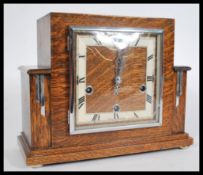 A vintage 1930's Art Decoy Royal Enfield  oak mantel clock of square form having inset 8 day