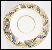 A 19th century Derby serving plate circa 1820 with gilt work and blue fauna patterning to the rim