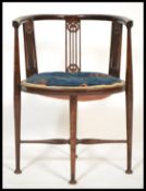 A 19th Century Victorian inlaid mahogany corner chair raised on turned legs united by stretchers.