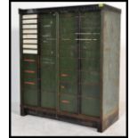 A vintage early 20th century Edwardian industrial metal filing cabinet having a graduating set of