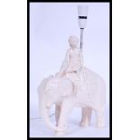 A vintage 20th century retro chalk ware lamp in the form of an elephant and rider, please see