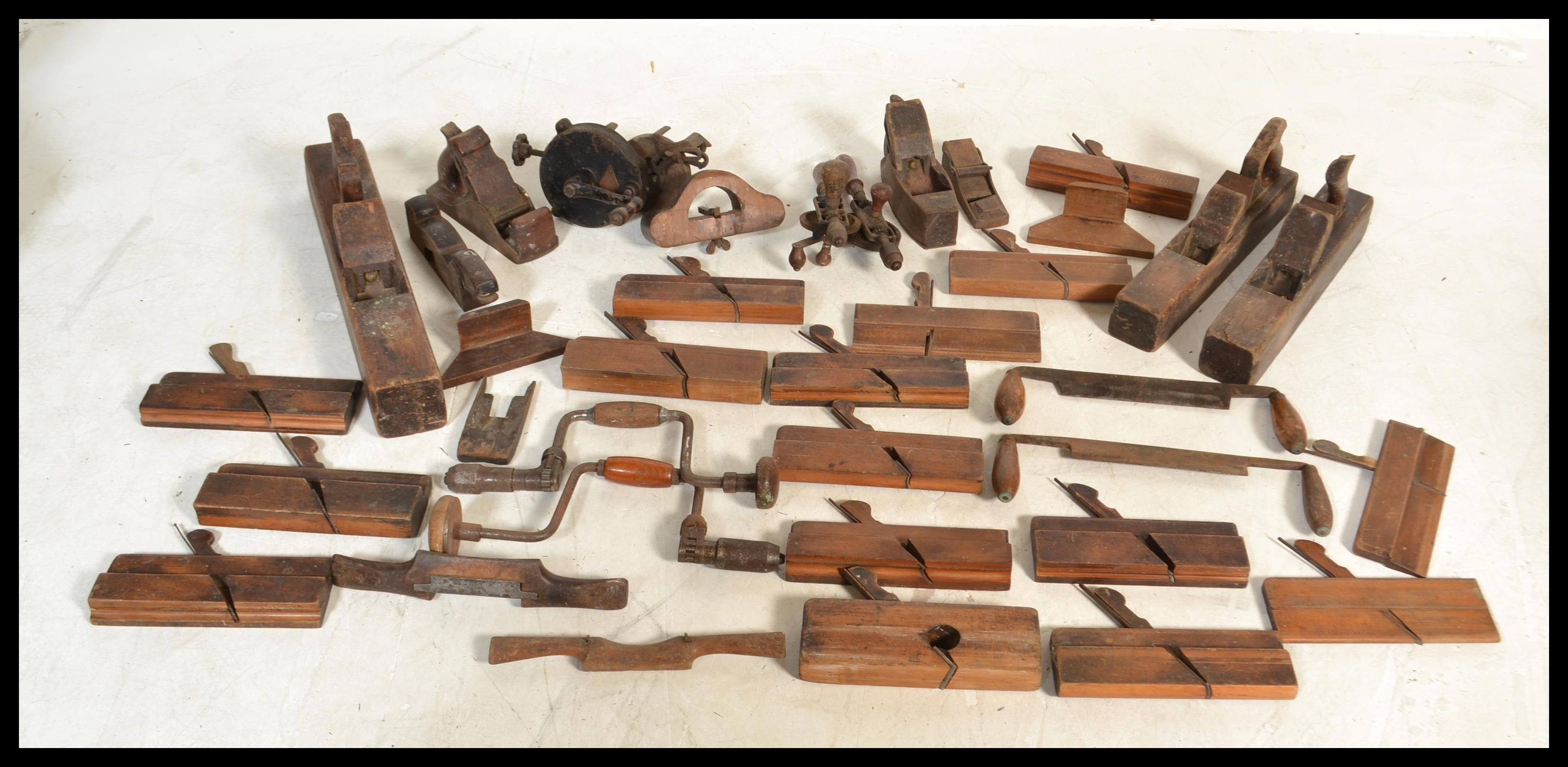 A good collection of vintage woodworking tools to include large wood plane, multiple smaller wood