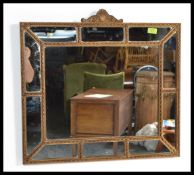 A 19th century decorative Venetian cushion wall mirror having gilt detailing with a notched