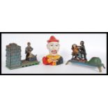 A group of three 20th century vintage novelty mechanical money boxes to include a cast iron clown