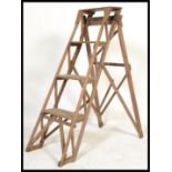 A vintage retro 20th century pine Industrial  metamorphic step ladder. The folding ladder having