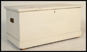 A Victorian painted pine blanket box having hinged top with plinth base