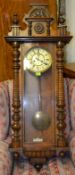 A Victorian walnut cased vienna regulator wall clock with good decorative large case having an