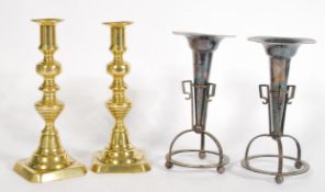 A group of 19th and 20th century candlestick holders to include a pair of brass Georgian candle