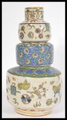 A fabulous Chinese cloisonne three step Gourd vase, decorated with flowers and wildlife in vibrant