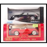 TWO BOXED 1:18 SCALE DIECAST MODEL CARS