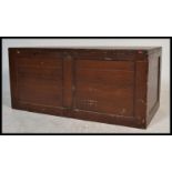 A large early 20th century pine blanket box chest. The large paneled body with hinged top having