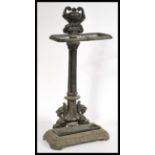 A 20th century cast iron stick stand in the manner of Coalbrookdale raised on a rectangular base