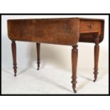 A 19th Century Victorian Pembroke mahogany drop leaf / gate leg dining table raised on turned