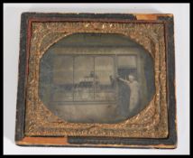 A 19th century ambrotype photograph of E. Fletcher confectioners shop with set into an embossed