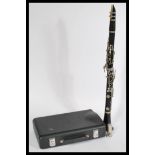 A cased Buffet Crampon & Co of Paris five piece clarinet, housed within its original case. Measures: