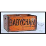 A vintage retro 20th century advertising point of sale Babycham wooden bottle storage crate with