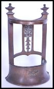 An early 20th century circa 1910 bronze miniature apprentice piece hall stand with sloped weighted