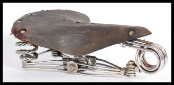 A vintage early 20th century Middlemores bike bicycle saddle seat having a leather seat pad on