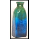 A vintage retro 20th century possible Monart studio art glass bottle vase having an iridescent
