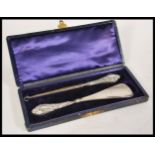 A group of silver hallmarked dressing table items to include shoe horn, button hooks, brush along