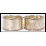 A group of four hallmarked Birmingham silver late 19th century Victorian napkin rings, two having