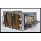 A vintage 20th century Princess of Wales button accordion squeezebox with royalty print bellows with