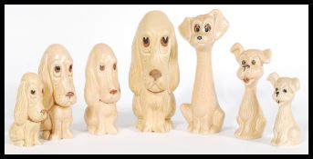 A selection of vintage 20th century ceramic dog figurines to include four graduating long eared