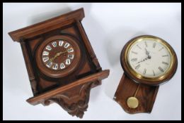 A vintage German blackforest type wall clock along with another wall clock. Please see images.