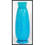 A late 19th century turquoise Burmantofts faience art pottery vase having engraved floral patterning