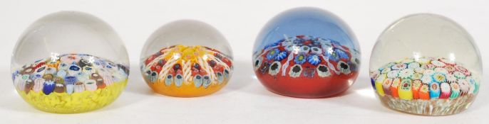 A collection of Millefiore paperweights of round bulbous form, some having helix detailing. Please