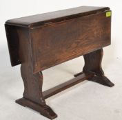An early 20th Century occasional table / apprentice piece in the form of an oak drop leaf dinning