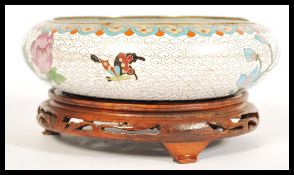 A 1920's/30's cloisonne bowl having a enameled floral peony design, Japanese style patterning to the