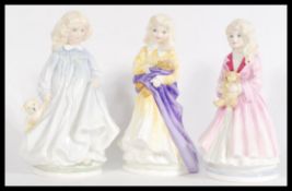 A group of three Royal Doulton figures Faith HN3082, Hope HN3061 and Charity HN3087. All limited