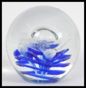 An early 20th century large heavy studio art glass paperweight dump having a large central bubble on