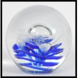 An early 20th century large heavy studio art glass paperweight dump having a large central bubble on