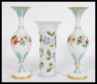 A group of three 19th century continental glass vases to include a pair of bulbous vases and a