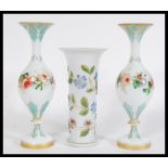 A group of three 19th century continental glass vases to include a pair of bulbous vases and a