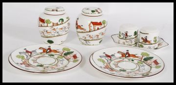 A crown Staffordshire fine bone china table set having a hunting scene pattern to include a pair