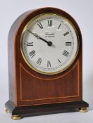 A vintage 20th century Comitti of London mahogany cased mantel clock having a spire case. Please see