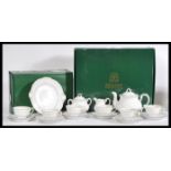 A vintage boxed Zsolnay Hungarian ceramic tea service consisting of cup saucers and side plates,