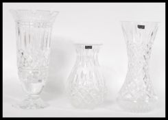 A group of three 20th century cut glass crystal vases to include two Stuart and one Waterford having