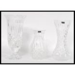 A group of three 20th century cut glass crystal vases to include two Stuart and one Waterford having