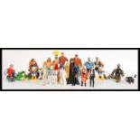 A group of vintage action figures to include Star Wars Darth Vader, C3PO, R2D2, Princess Leia,