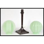 A vintage early 20th century Bakelite Art Deco lamp on a square base with two circular mint green