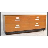 A vintage 20th Century four drawer beech wood architects industrial plan chest of drawers having