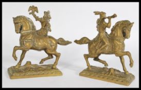 A pair of 19th Century cast brass sculptures / figurines modeled as hunters, one of a Falconer and