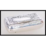 A 19th century Victorian silver snuff box having an embossed floral decoration to the lid with plain