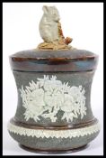 George Tinworth for Doulton Lambeth, a late 19th century lidded stoneware tobacco jar, decorated