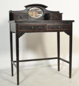 An early 20th Century ebonised mahogany  writing table desk, having an arrangement of drawers raised
