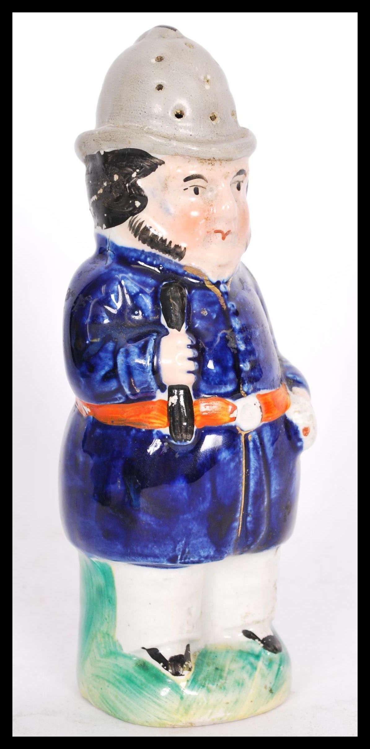 A 19th century late Victorian Staffordshire policeman pepper pot on a circular base with a blue - Image 6 of 7